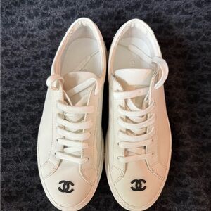 CHANEL Women's Cream Sneakers with Black Logo